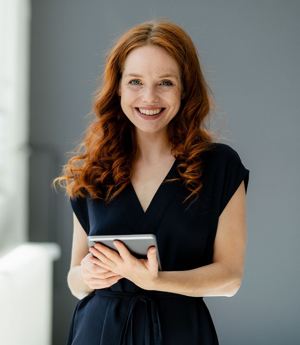 portrait-of-content-redheaded-businesswoman-with-d-EYLN464.jpg